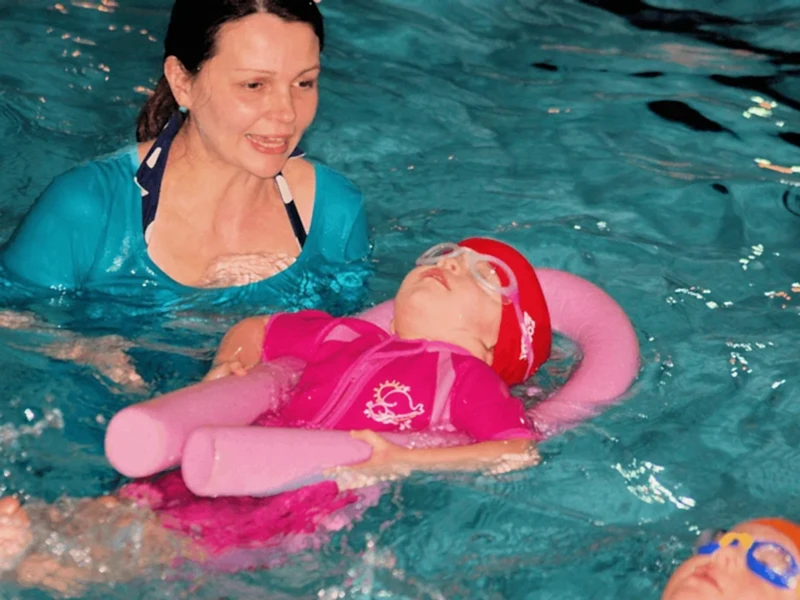 toddler swim back float with instructor toddler swimming back float with instructor